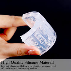 Laza mold beside a fingertip for scale, shows sizes fit typical nail beds