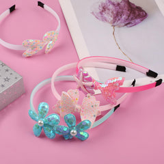 Leery headband beside a ruler illustrating adjustable size and scale