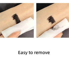 LESITI mascara next to coin to show compact travel-friendly size benefit