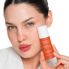 LeVaye' applying serum to neck showing hydration and smoothing benefit