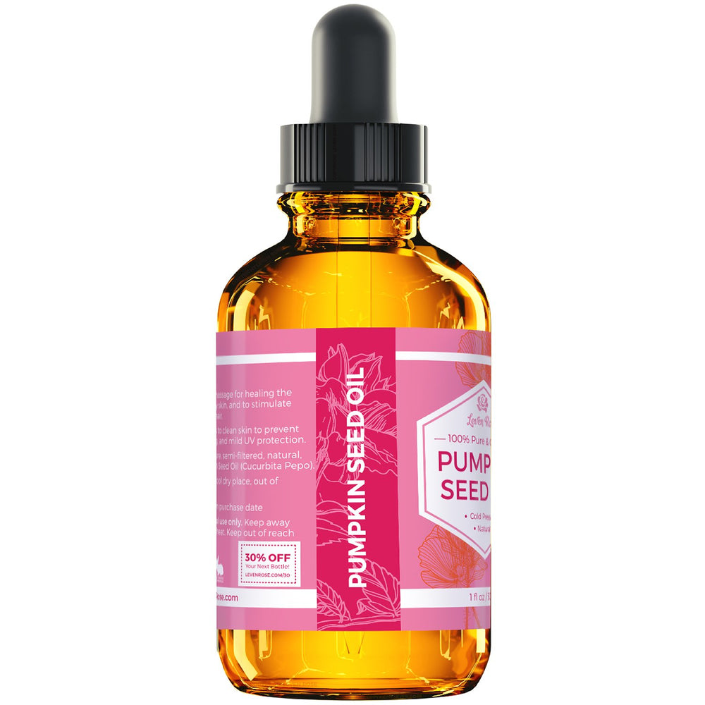 Leven Rose oil droplet on fingertip showing silky texture and absorption
