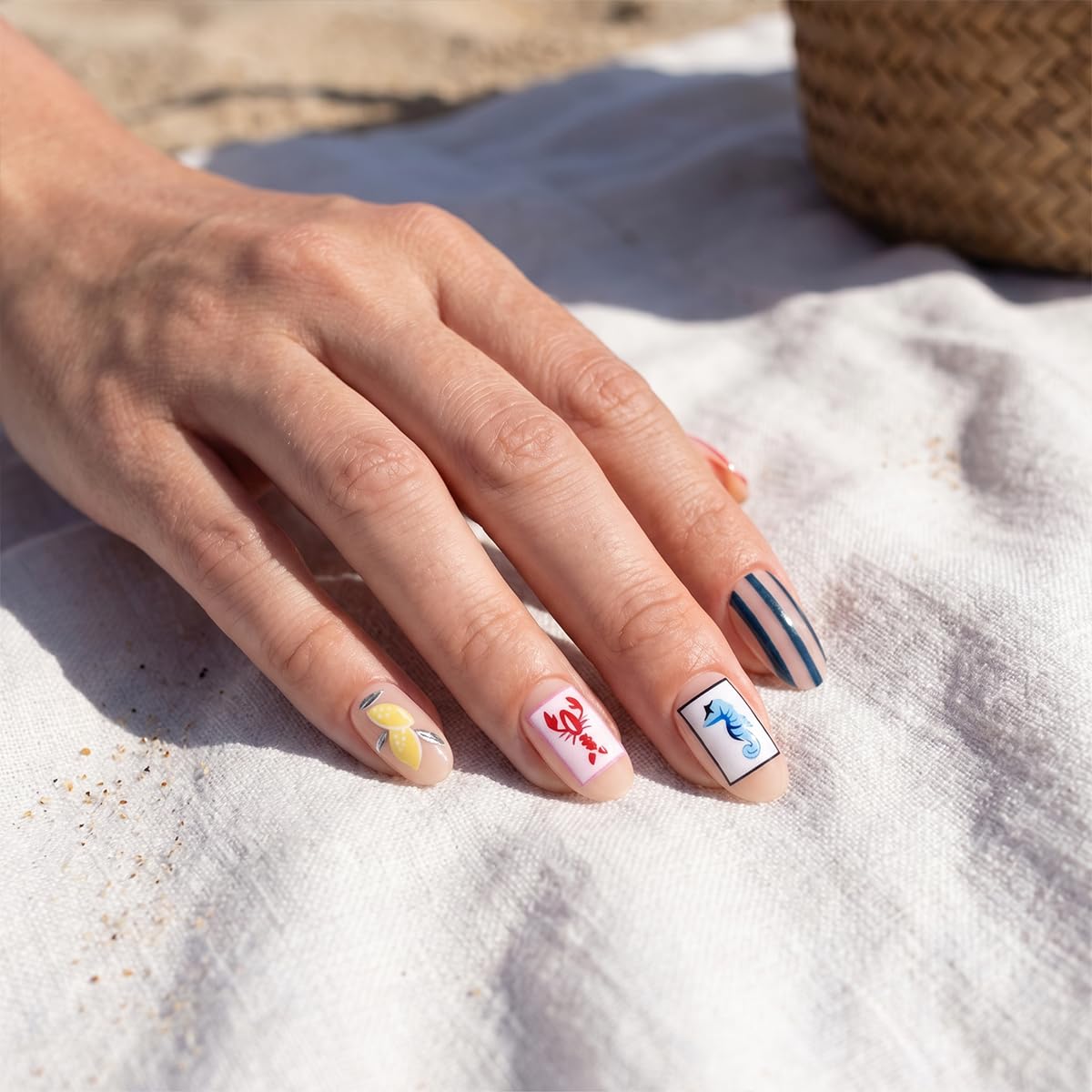 LFAAYYF assorted nails showing lemon, flower, seahorse and stripe designs for summer style
