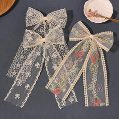LFOUVRE bows styled half-up ponytail illustrating easy everyday styling