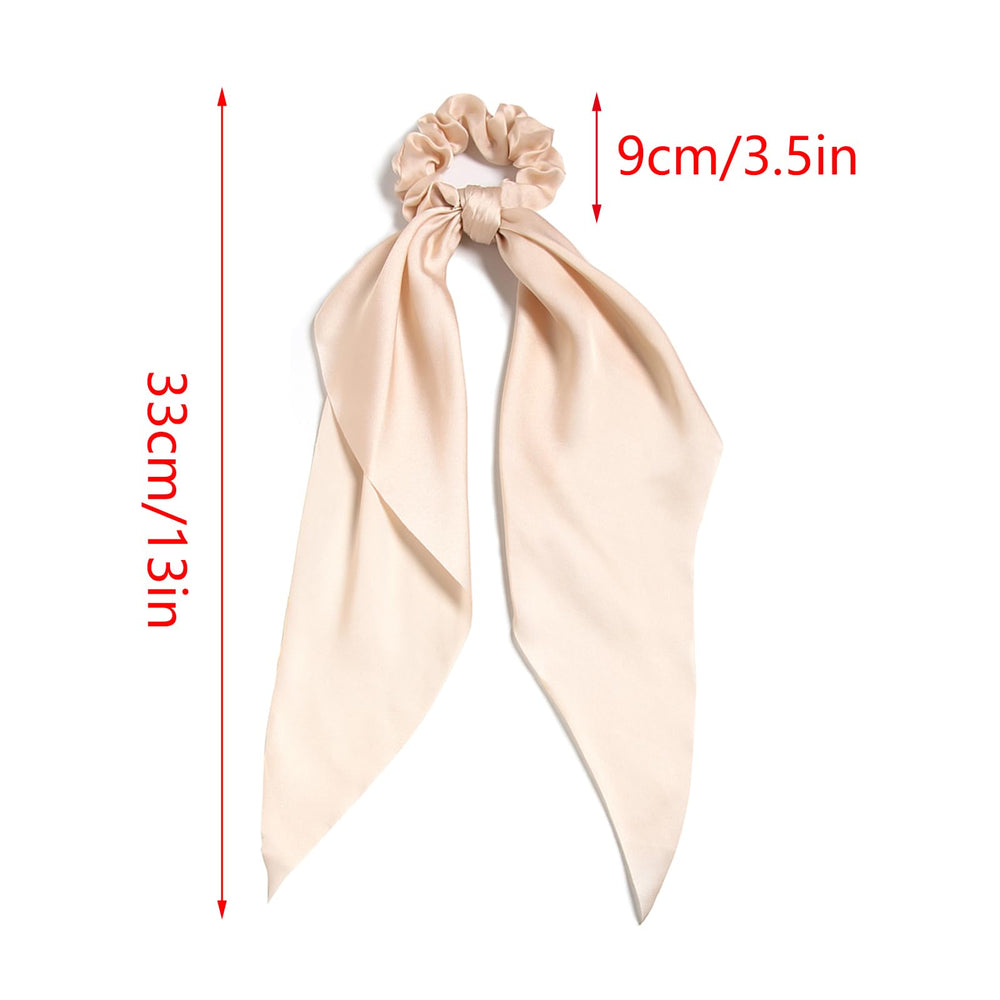LFOUVRE model securing a ponytail with scrunchie showing quick polished styling benefit