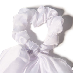 LFOUVRE ribbon tied to handbag as accessory benefit: coordinates outfit and bag