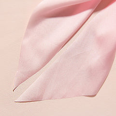 LFOUVRE scrunchie held in hand showing scale and comfortable elasticity