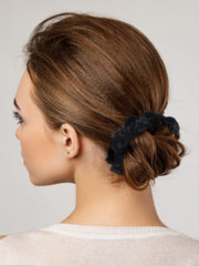 LFOUVRE scrunchies in a travel pouch ready for on-the-go hair fixes