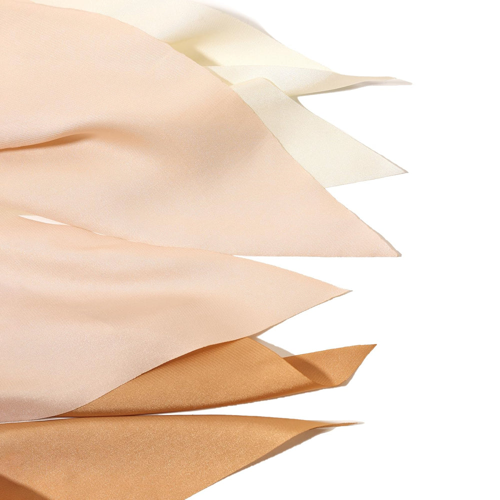 LFOUVRE ribbon tied on a handbag strap showing decorative accent and outfit coordination