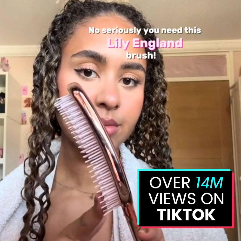 Lily England brush detangling wet hair in shower to minimize breakage and ease knots