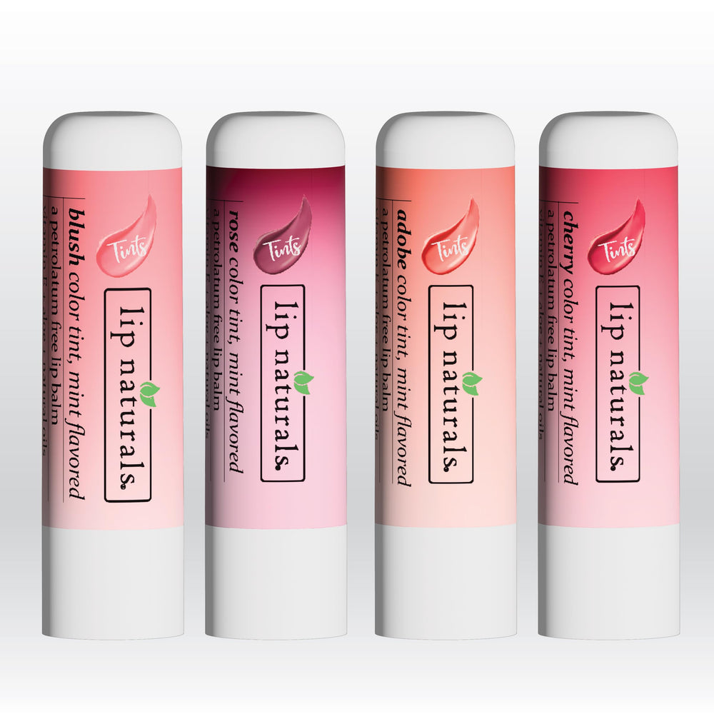 Lip Naturals balm next to a coin demonstrating compact, travel-friendly size