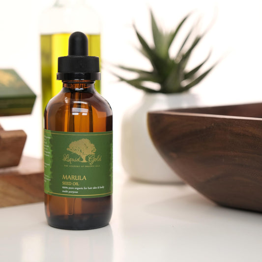 Liquid Gold Inc dropper releasing a precise drop for controlled application benefit