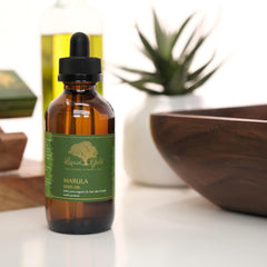 Liquid Gold Inc dropper releasing a precise drop for controlled application benefit