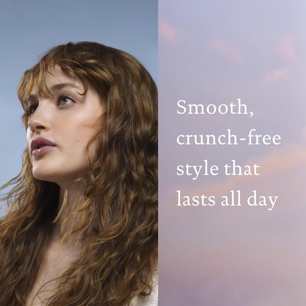 Living Proof styling product on curly hair reducing frizz and improving shape