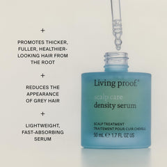 Living Proof bottle next to ruler showing compact size and travel-friendly benefit