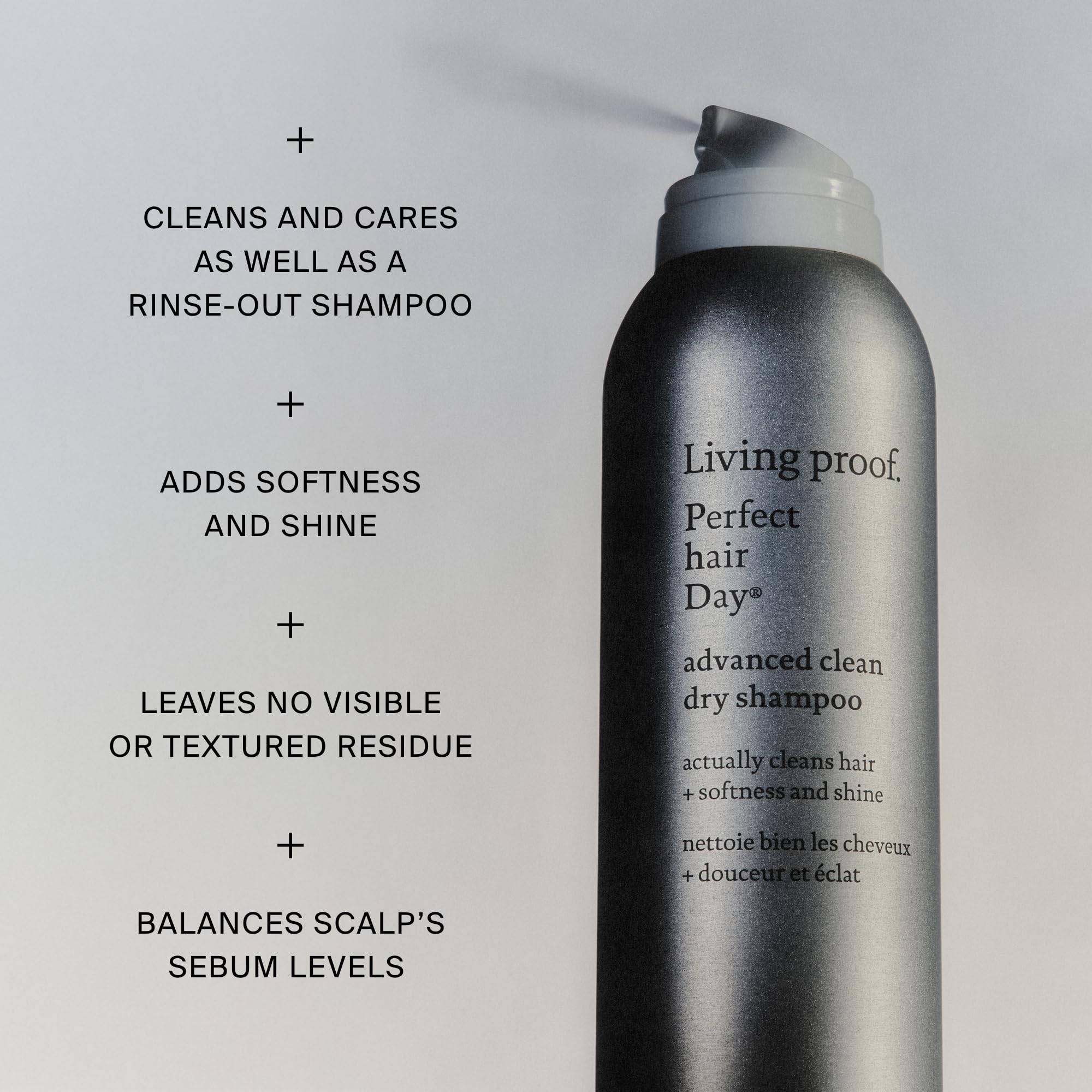 Living Proof dry shampoo being sprayed at roots demonstrating oil absorption benefit