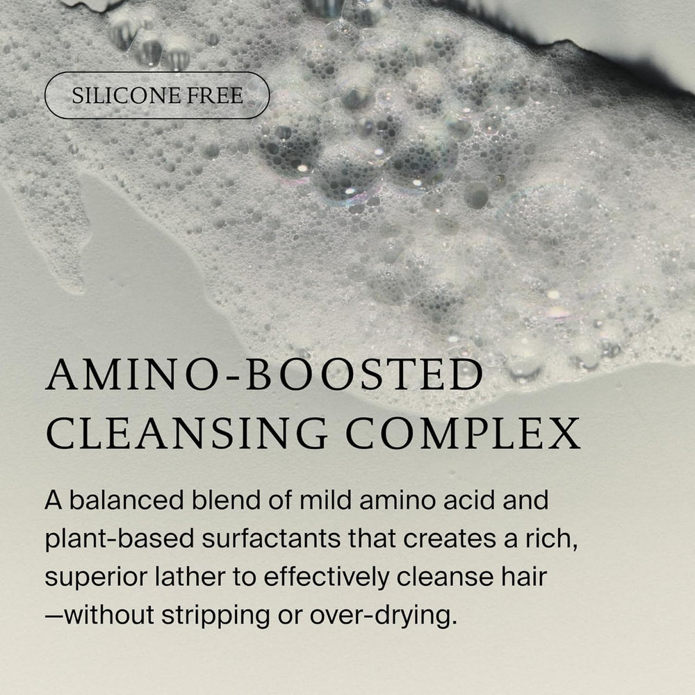 Living Proof applying shampoo to wet hair for effective cleansing
