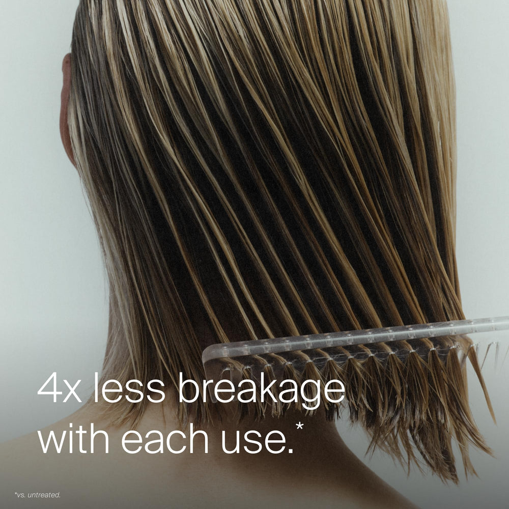 Living Proof being sprayed before brushing to reduce tangles and breakage