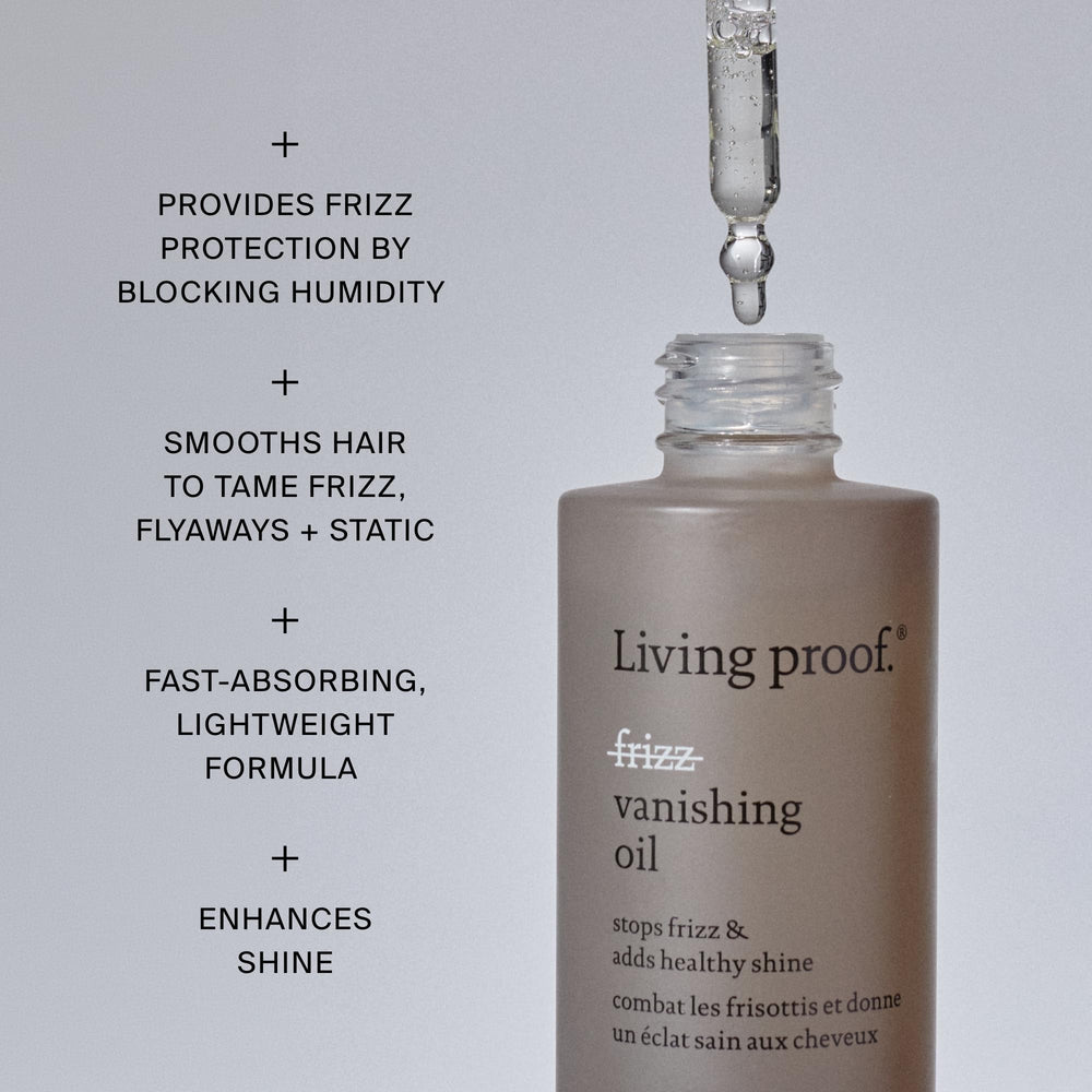 Living Proof oil being smoothed through mid-lengths showing frizz reduction benefit