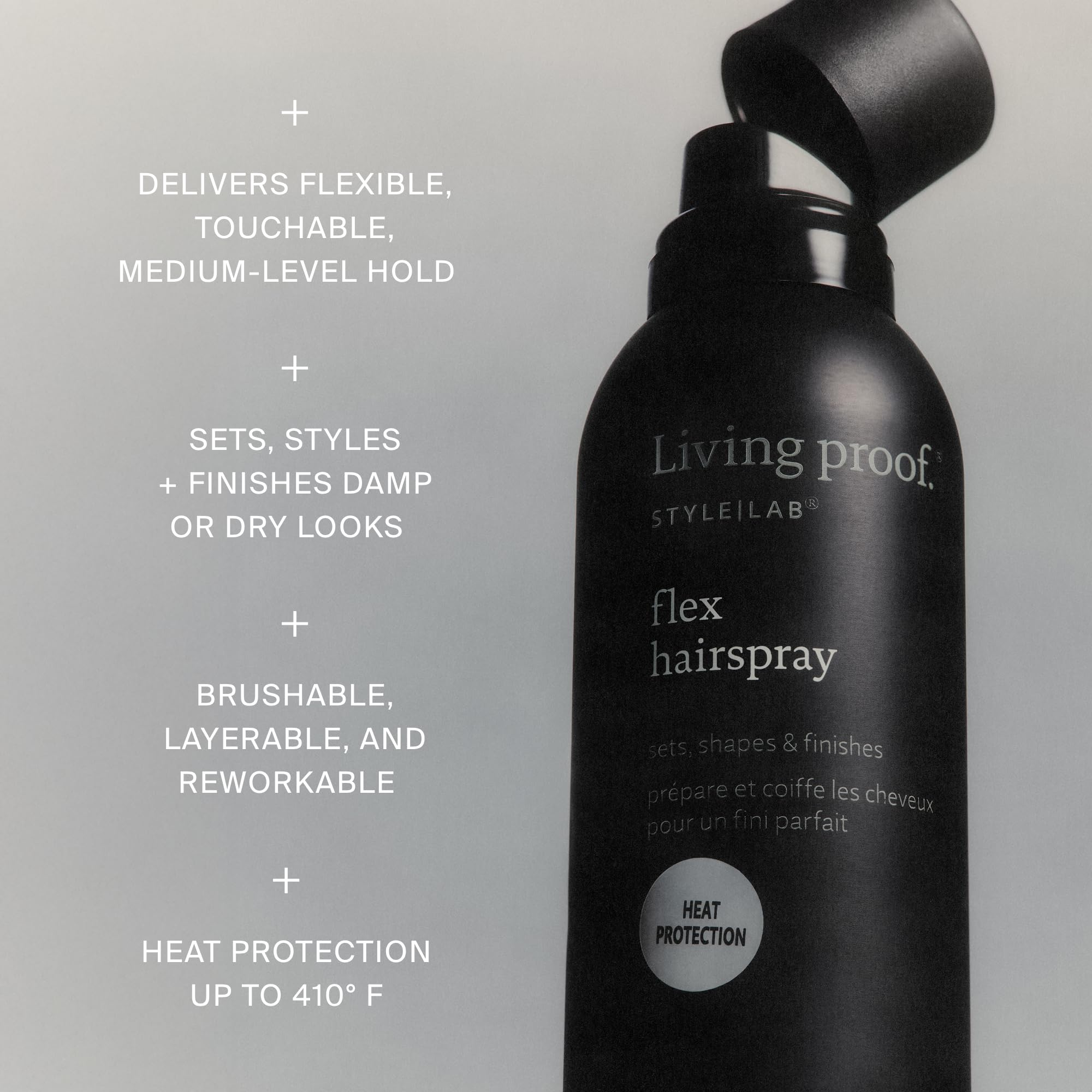 Living Proof travel-size bottles next to passport to show compact scale
