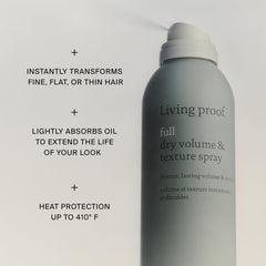 Living Proof texture spray held in hand to show travel size and portability benefits