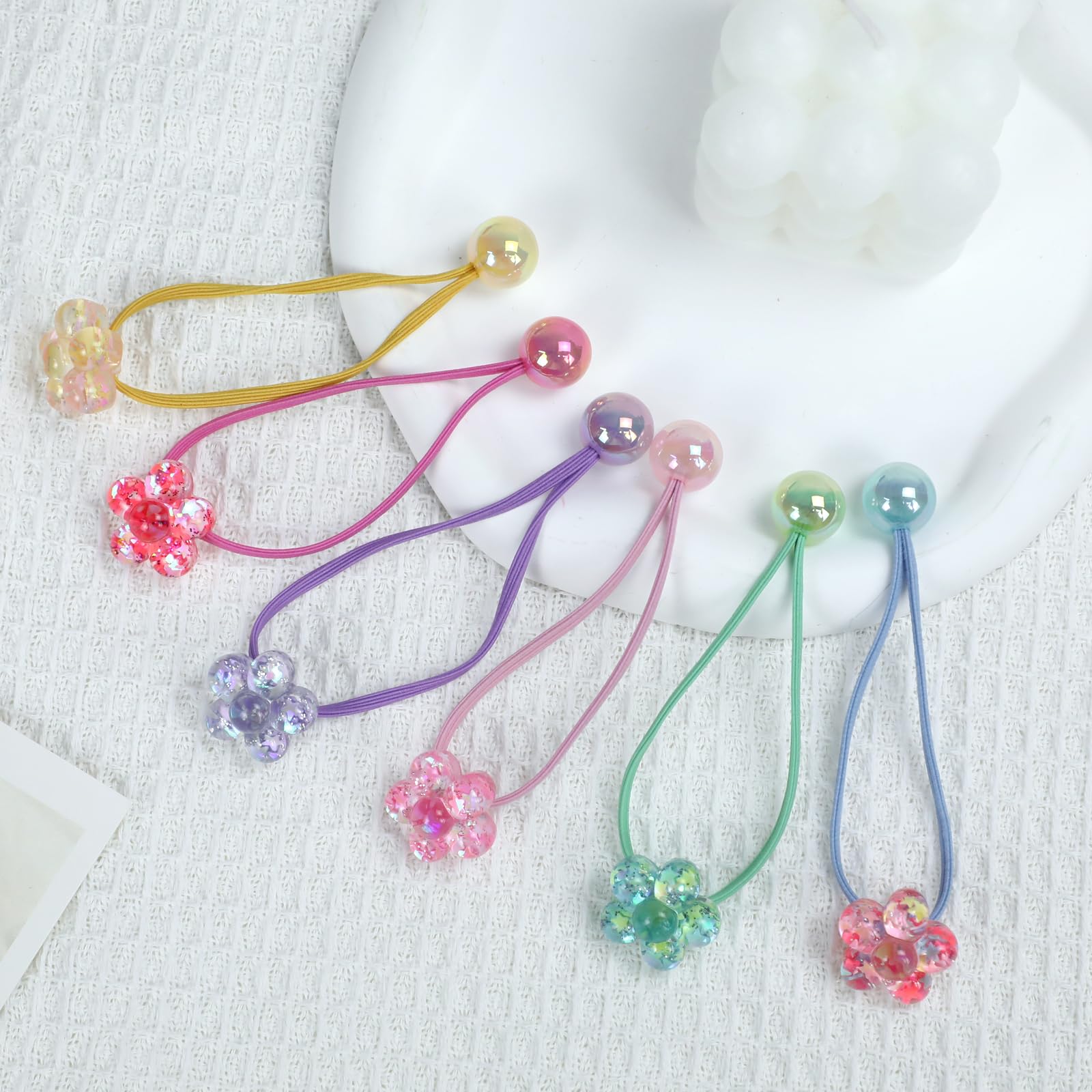 LIYAZHIL hair ties on a hand for scale and easy sizing benefit