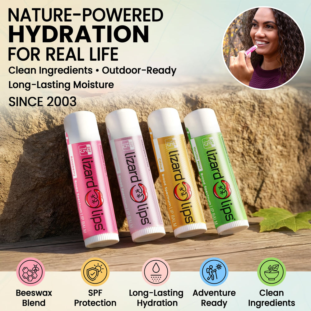 LizardLips tubes on a beach towel for vacation-ready lip care and UV protection