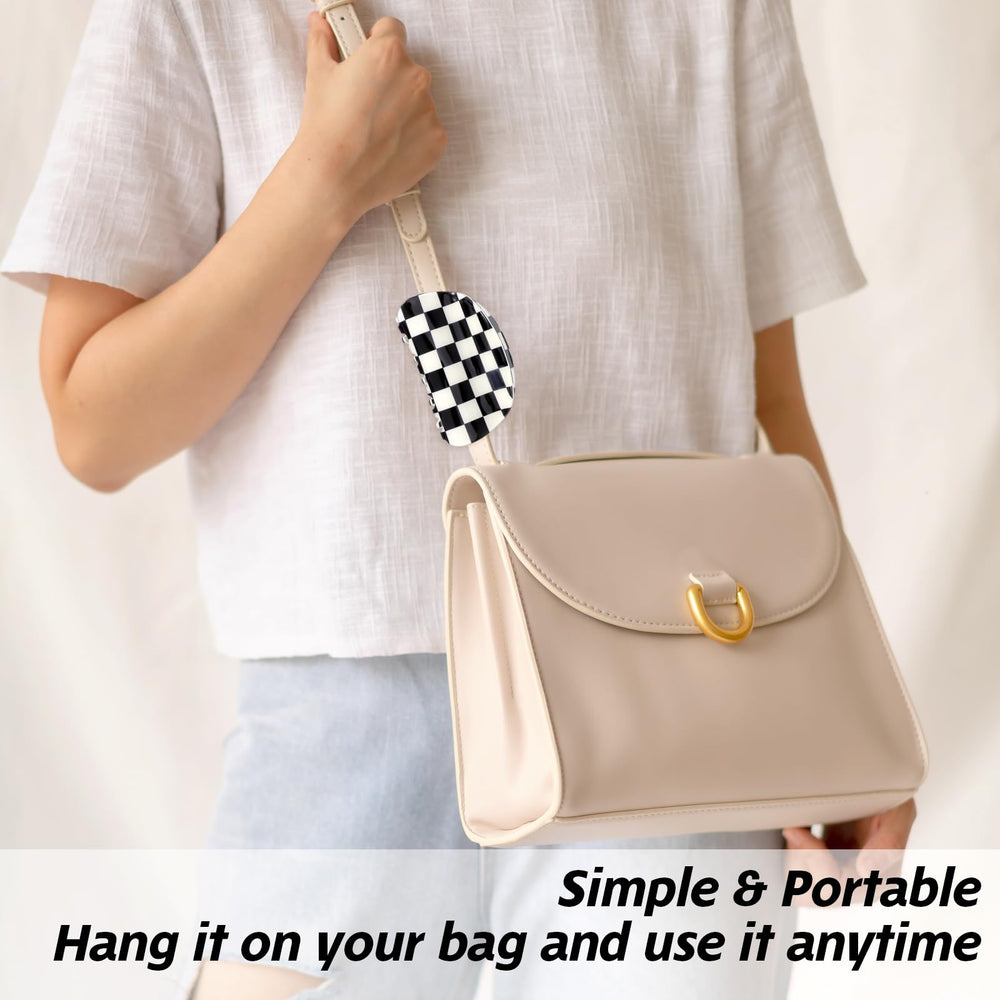 LLOUSSAK clips attached to travel bag illustrating portable hair accessory convenience