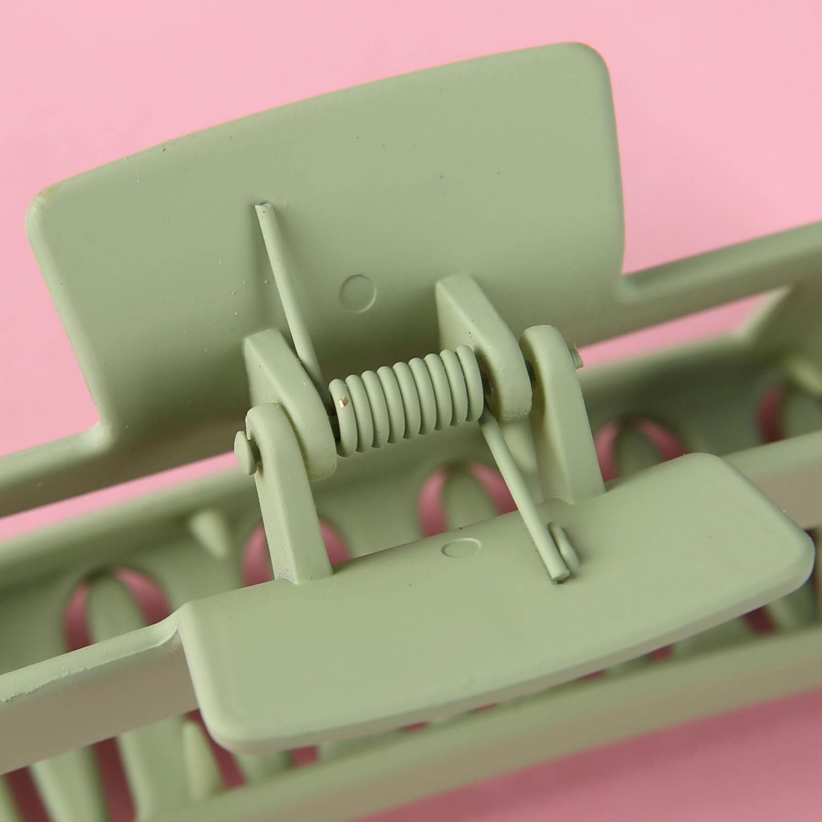 Loanzeg clip held in hand to show 4.1-inch scale and easy handling benefit