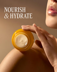 L'OCCITANE cream on bathroom shelf in lifestyle scene conveying daily ritual and luxury benefit