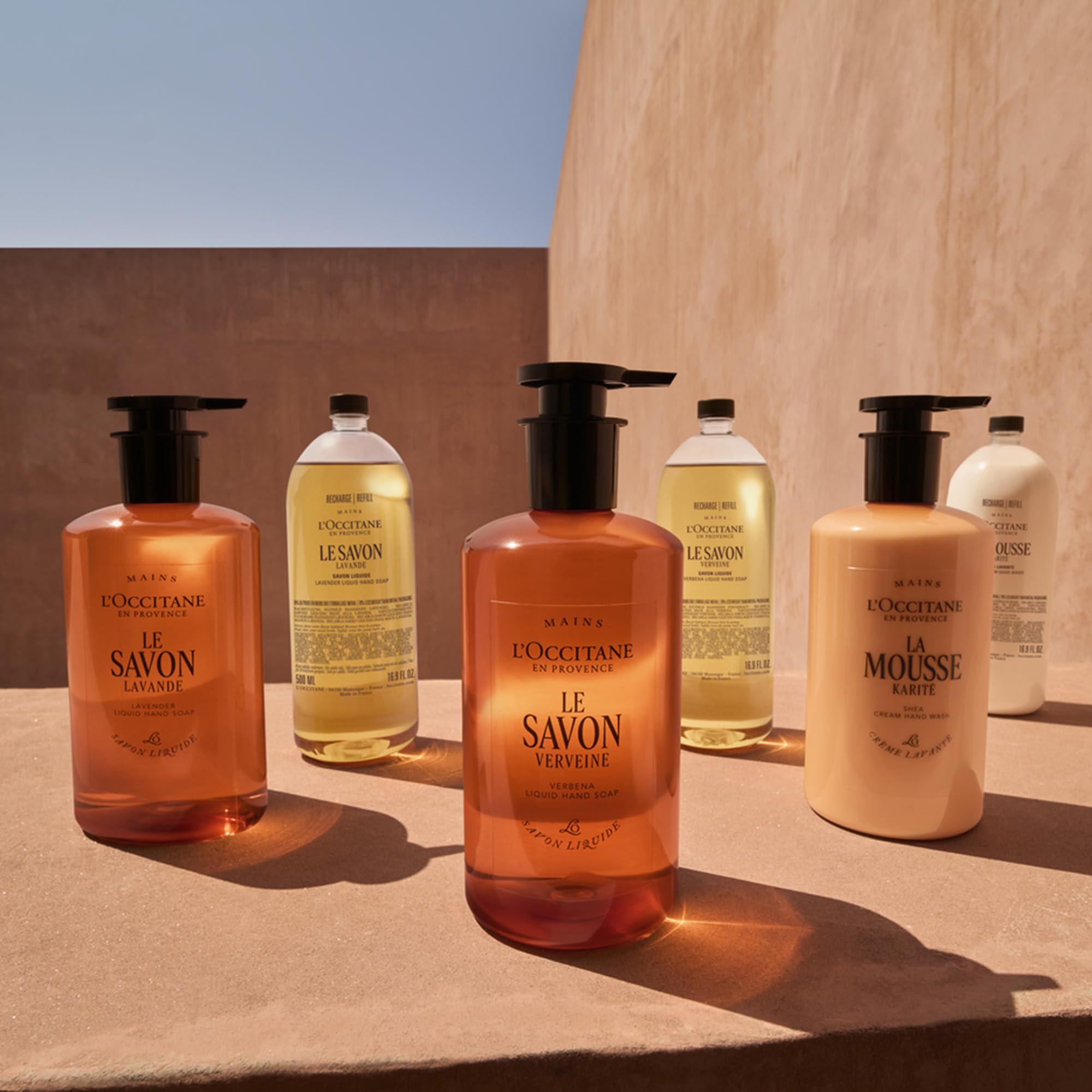 L'OCCITANE used in shower on arm showcasing mild body cleansing benefit
