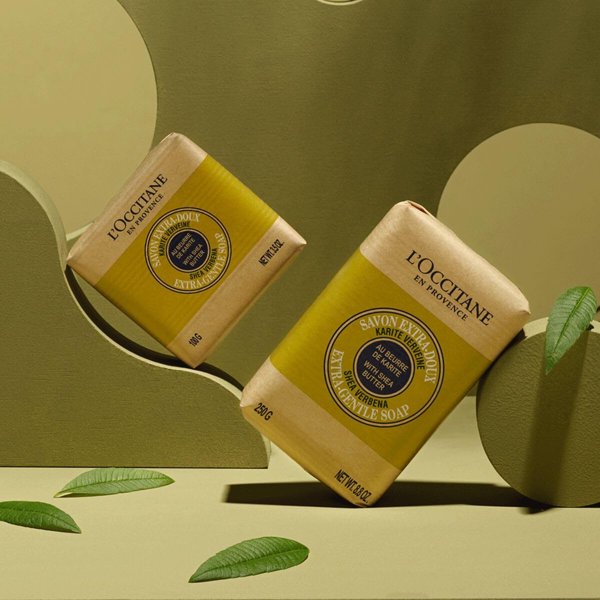 L'Occitane Shea Verbena soap held in hand showing size and convenient daily-use benefit
