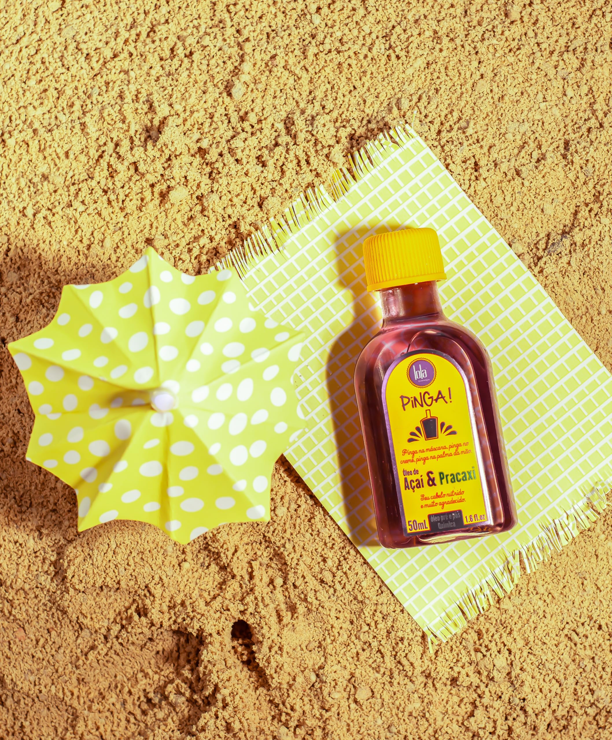Lola Pinga bottle held in hand demonstrating travel-size convenience benefit