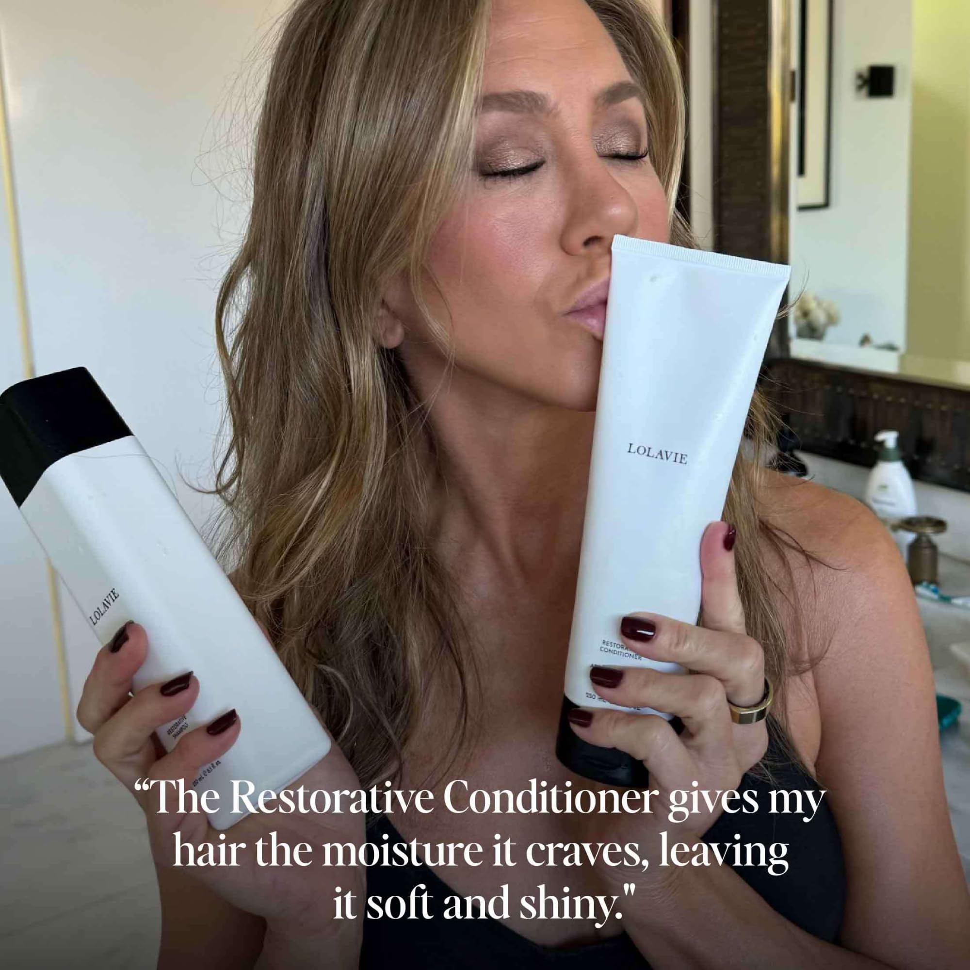 LolaVie conditioner being combed through hair to reduce breakage
