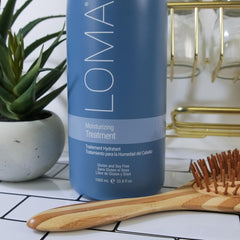 Loma bottle on bathroom shelf suggesting daily routine and visible shine