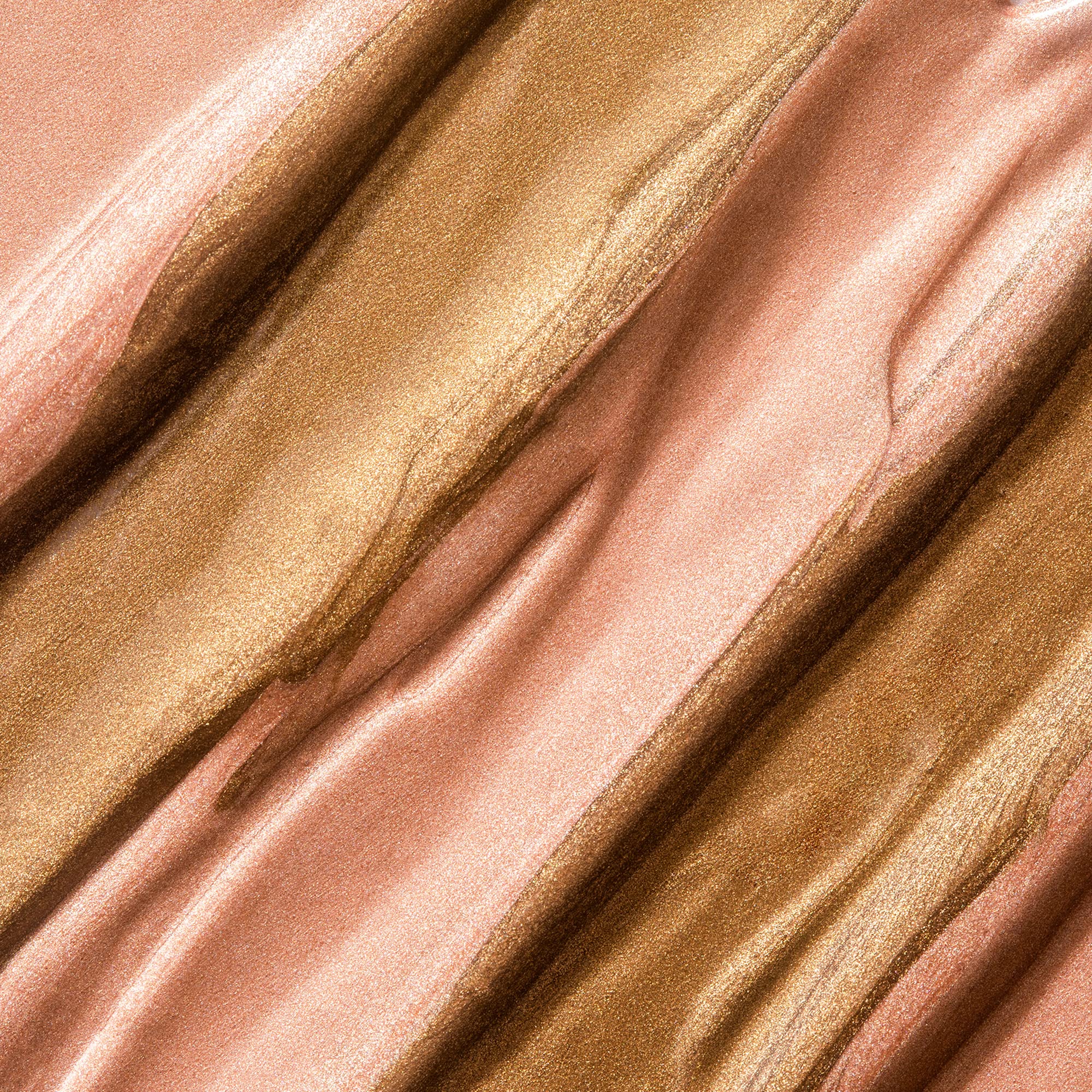 LORAC lifestyle beach glow scene showing sunlit, healthy-looking body radiance