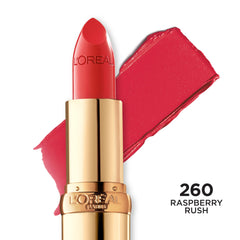 L'Oreal Paris lipstick held in hand for scale showing compact size benefit