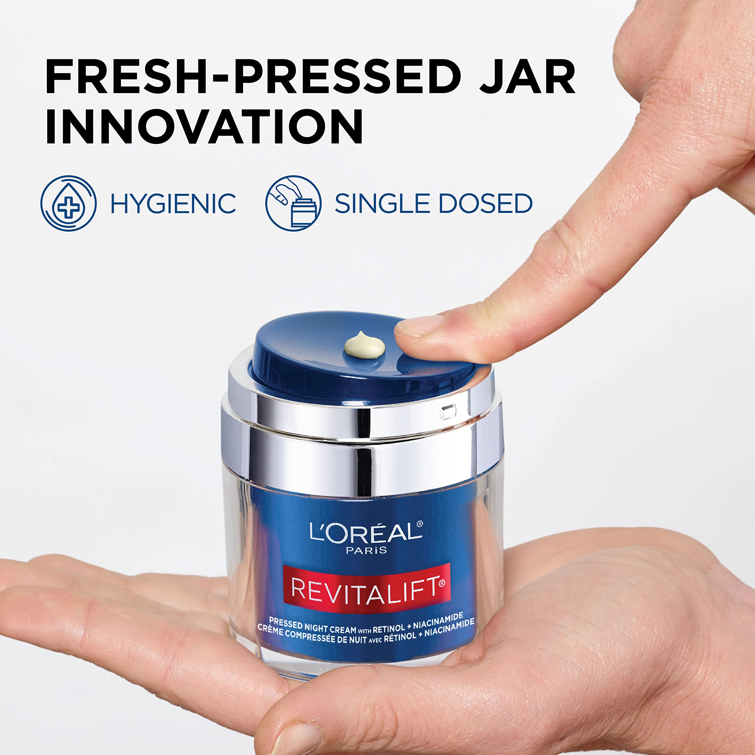 L'Oreal Paris 1.7 oz jar held to show scale and travel-friendly size