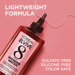 L'Oreal Paris applying treatment to wet hair in shower for quick eight-second use benefit