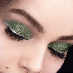 L'Oreal Paris swatch on skin showing vibrant green-gold payoff and buildable coverage