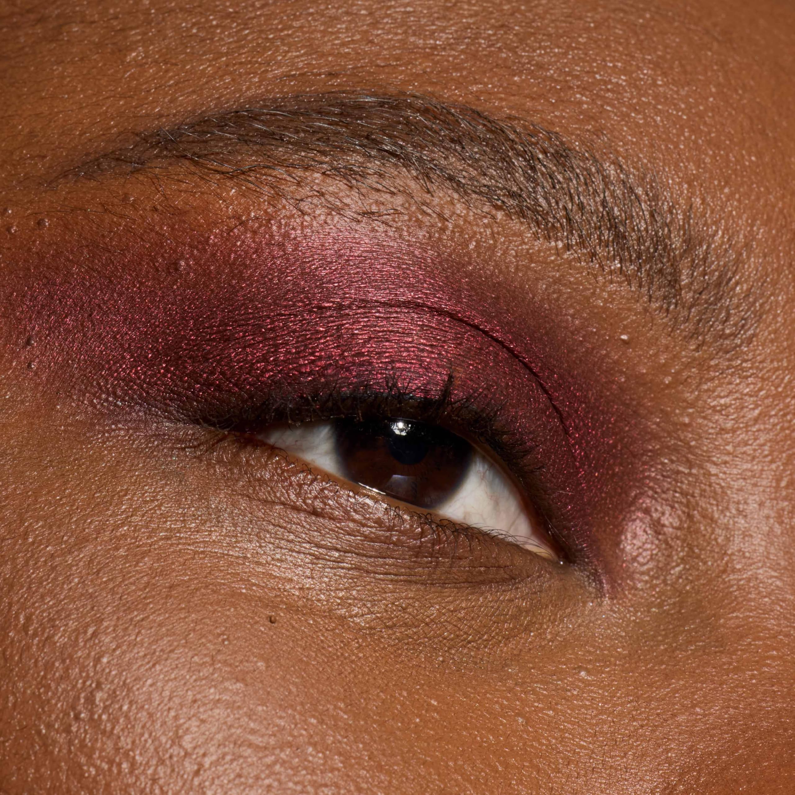 L'Oreal Paris shadow stick inside a travel makeup bag illustrating portability and quick touch-ups