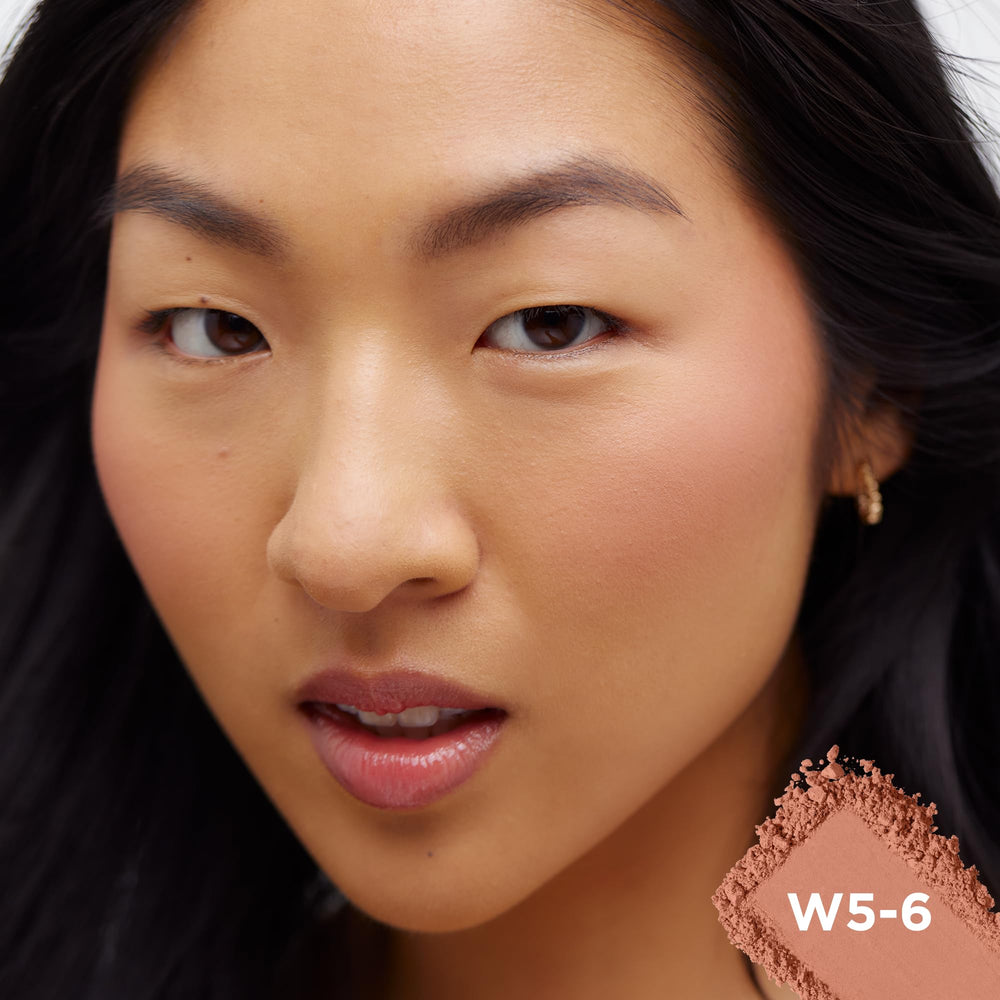 L'Oreal Paris model with Subtle Sable applied to cheeks benefit: natural-looking warmth