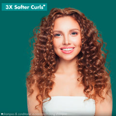 Love Beauty And Planet dispensing conditioner to show creamy texture and easy application