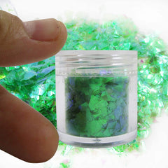 LoveOurHome nail art detail with flakes adding sparkle and textured highlights to manicure