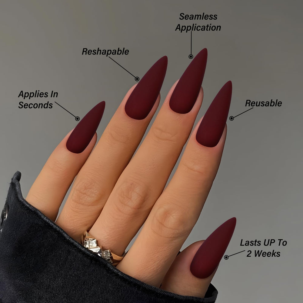 LoveOurHome hand next to coin showing long stiletto length for scale and impact