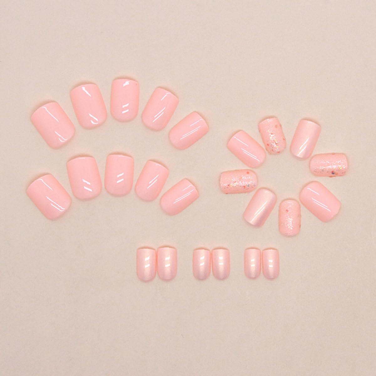 LRKNNO nails held in hand showing short square scale and practical length