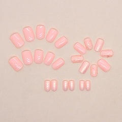 LRKNNO nails held in hand showing short square scale and practical length