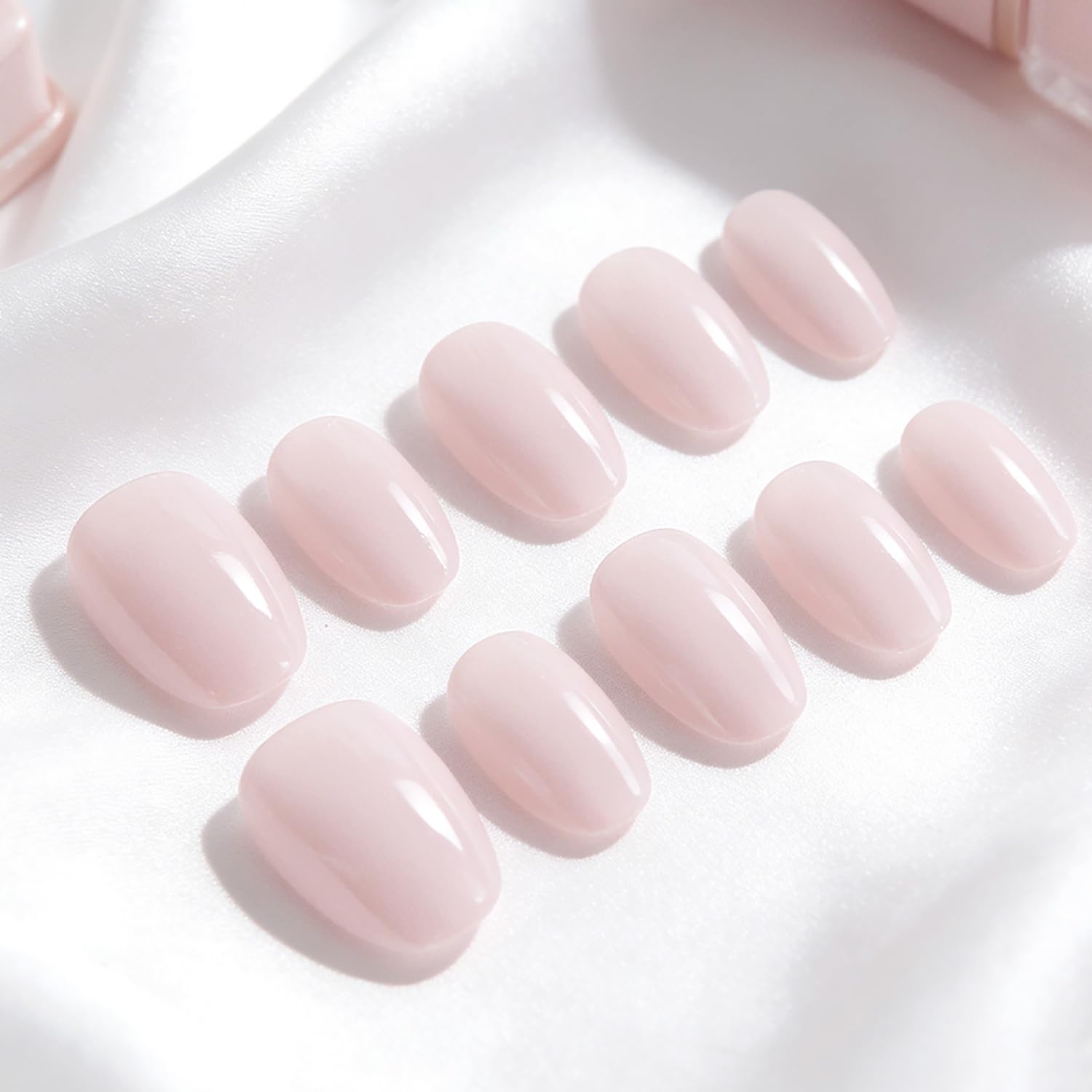 Lukmexor nails laid out with sizes and glue illustrating variety and application readiness