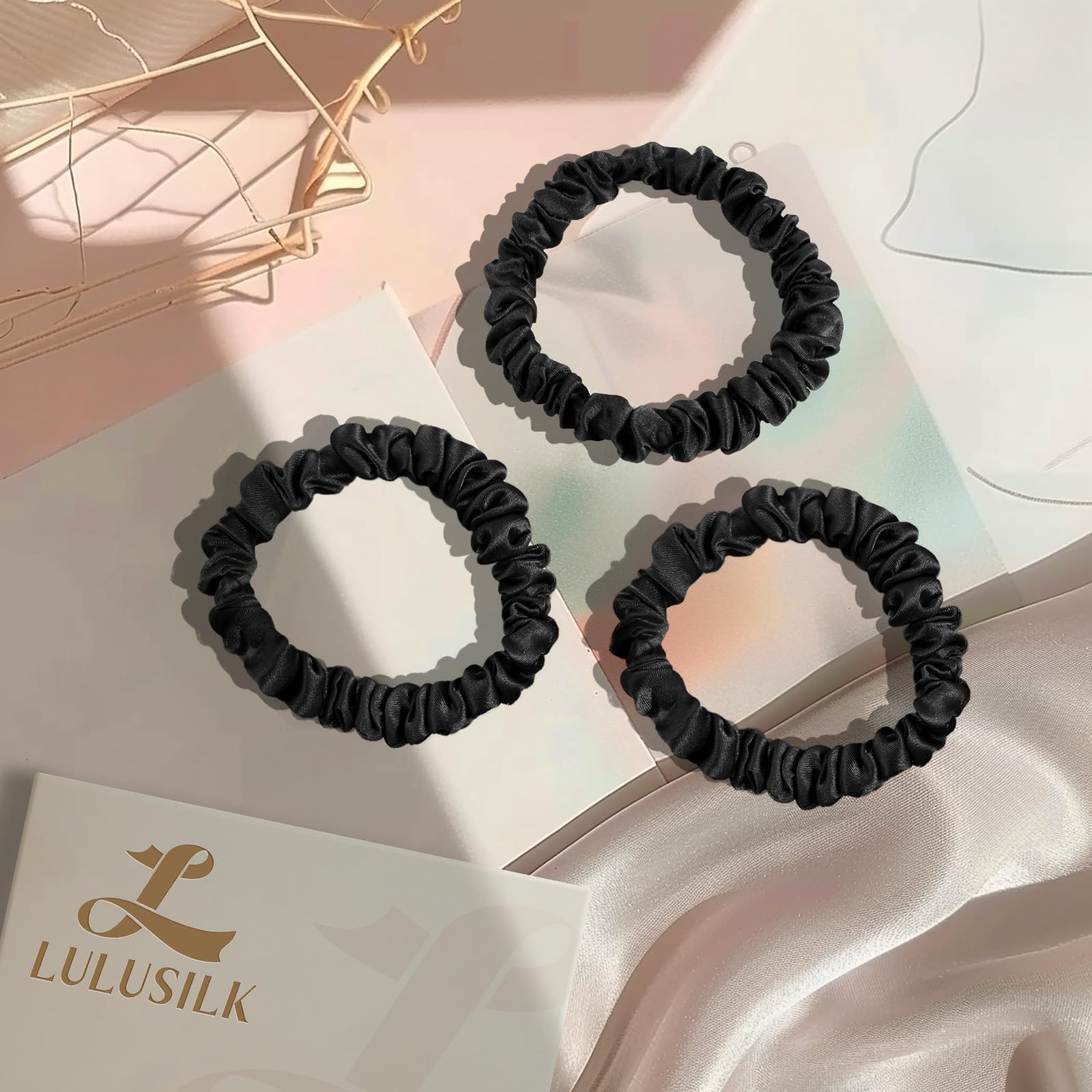 LULUSILK scrunchie on pillow in bedtime scene suggesting overnight style protection