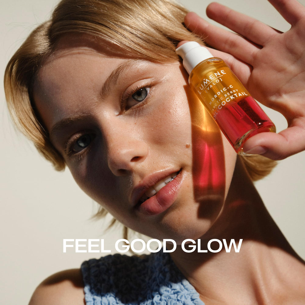 Applying Lumene oil to cheek emphasizing plumping and moisture boost
