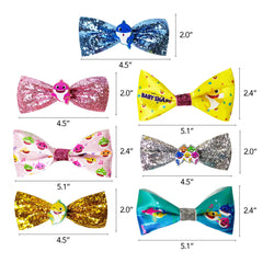 LUV HER bow held in hand to show size and child-friendly scale